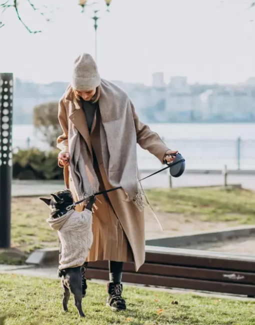 beautiful-woman-with-french-bulldog-walking-park